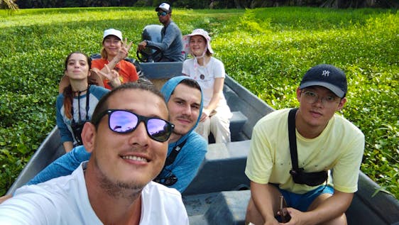 Volunteers on a boat for animal monitoring