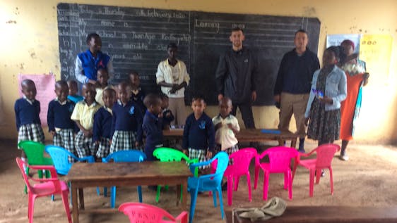 International Volunteers in class with children and local teachers.