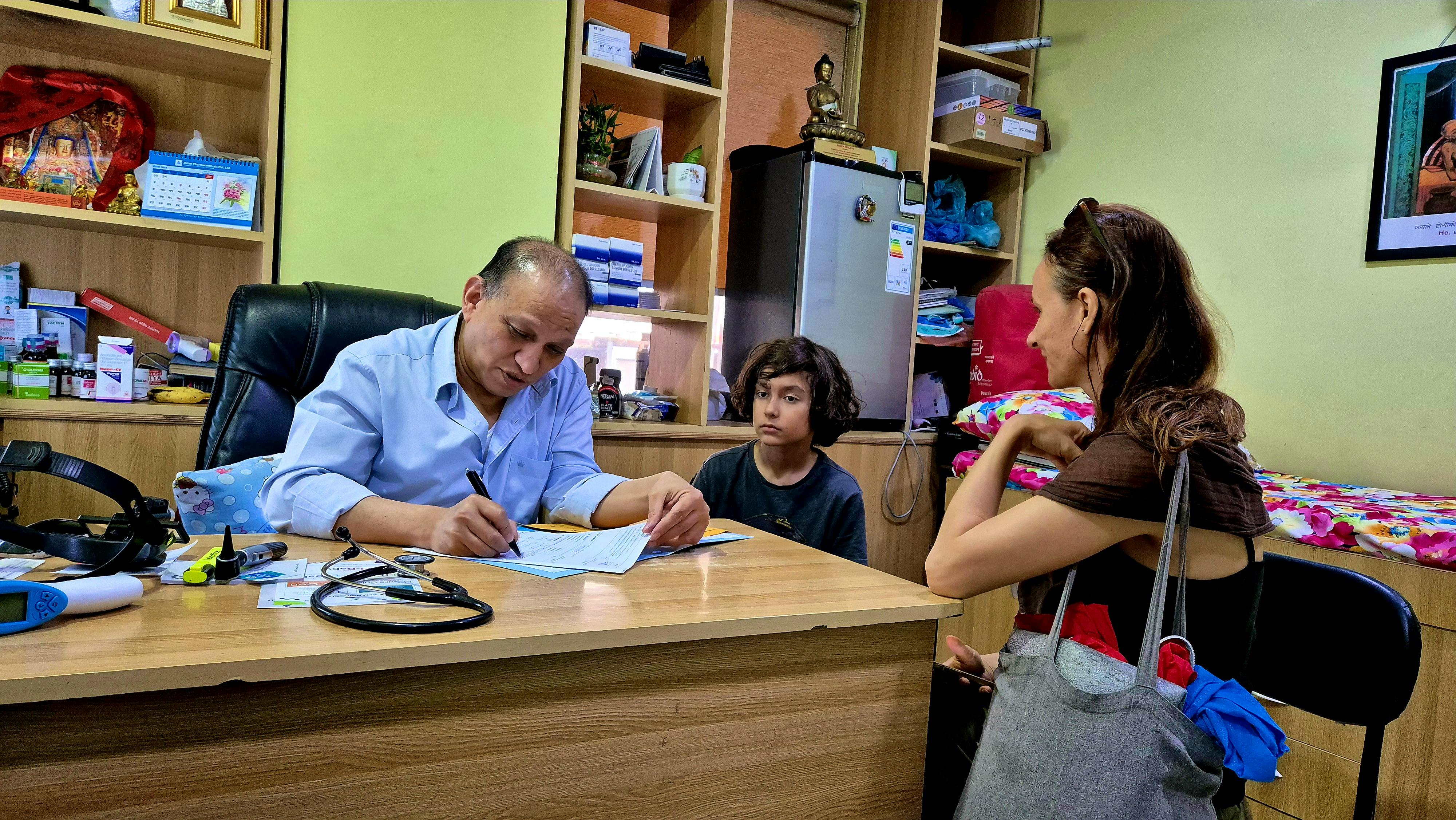 Senior  child Doctor checking a  tourist child in Kathmandu  