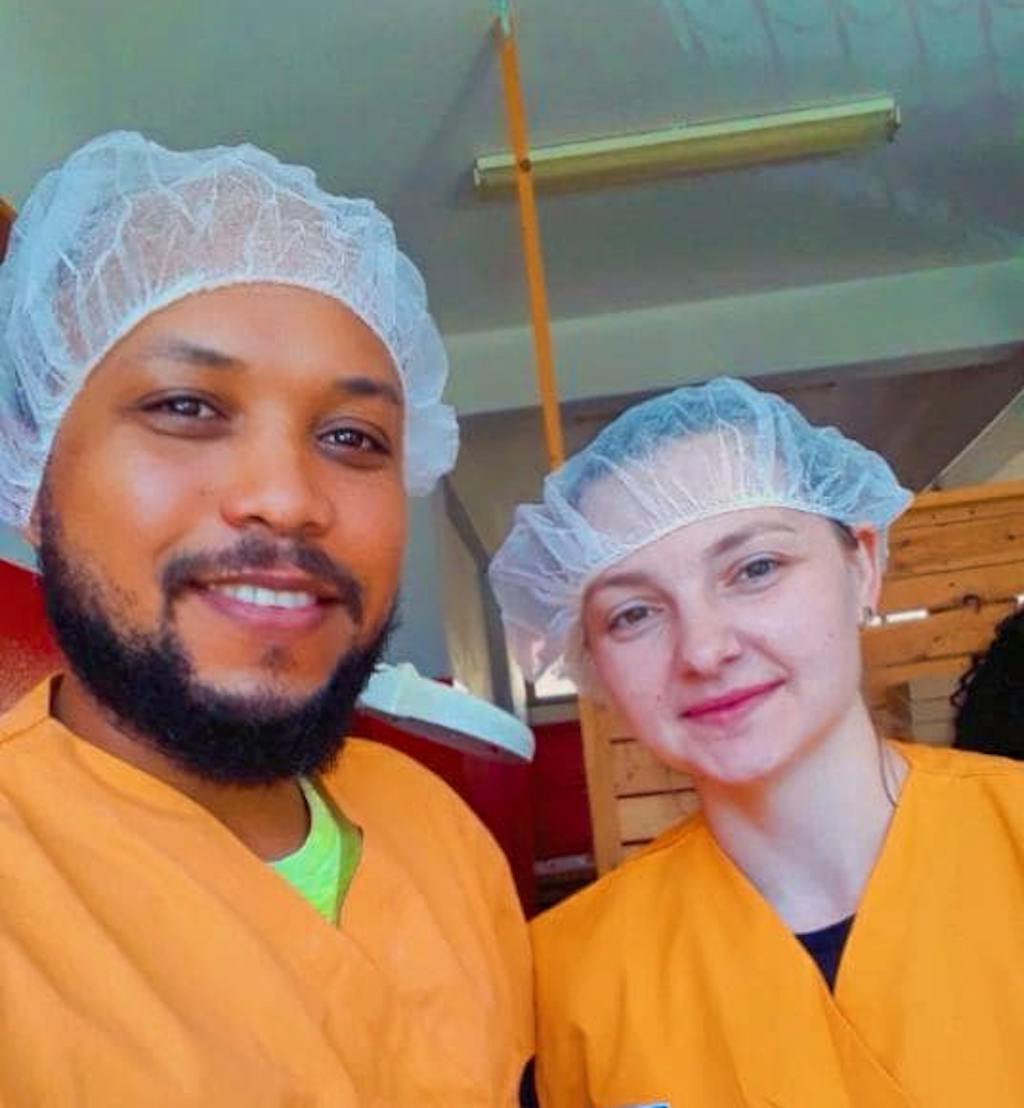 Local vet and vet student during a castration campaign