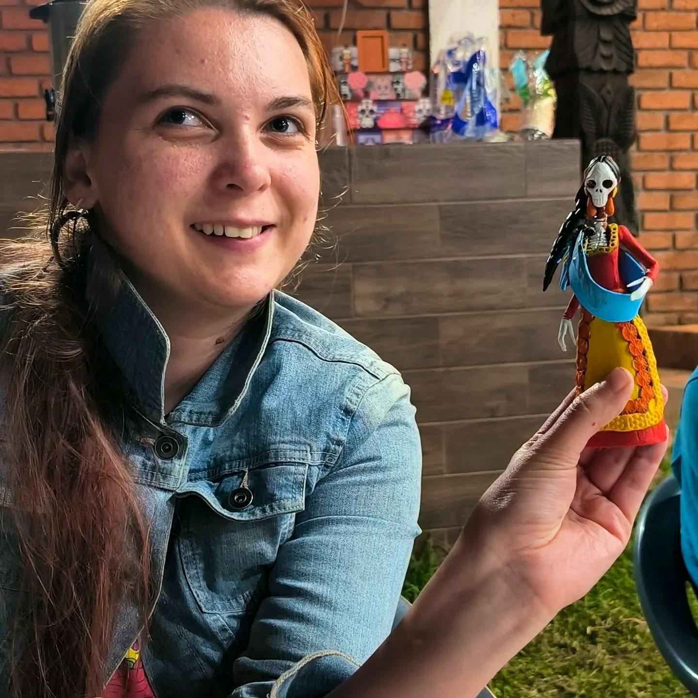 Our volunteer painting a catrina