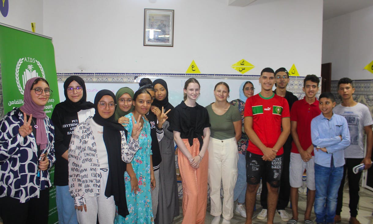 Our volunteers, Amy and Nell, are teaching English to a group of local students. 