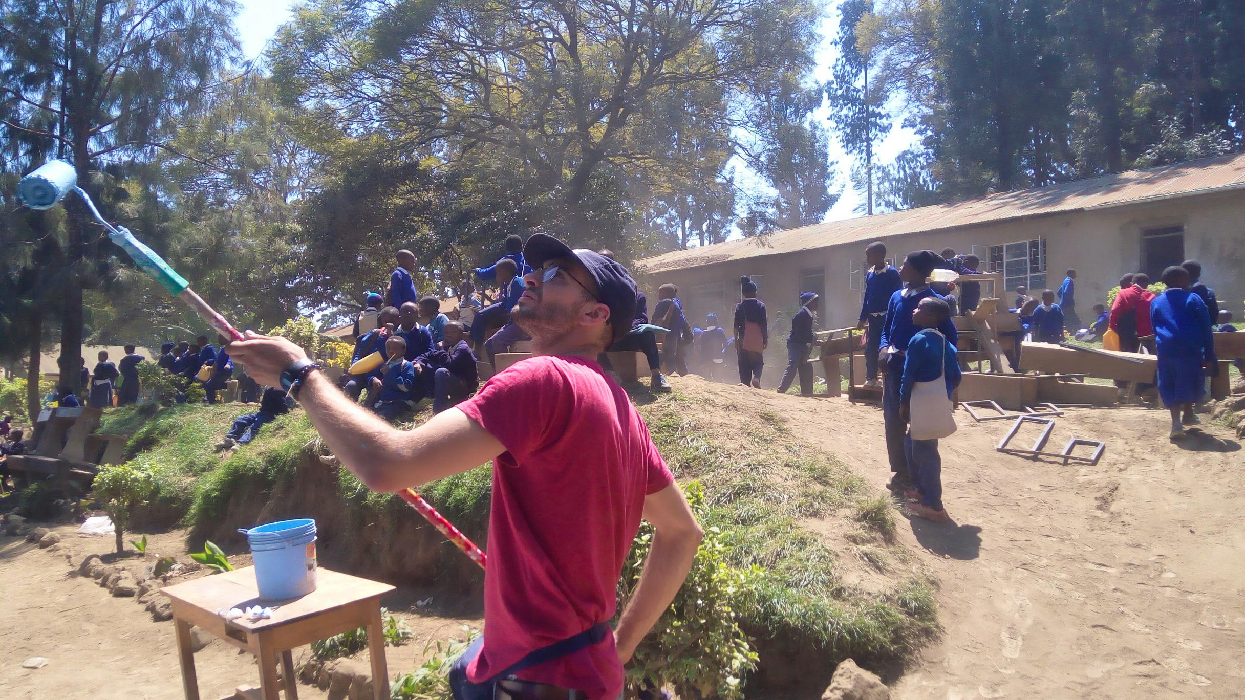 Our volunteer in action painting at the school